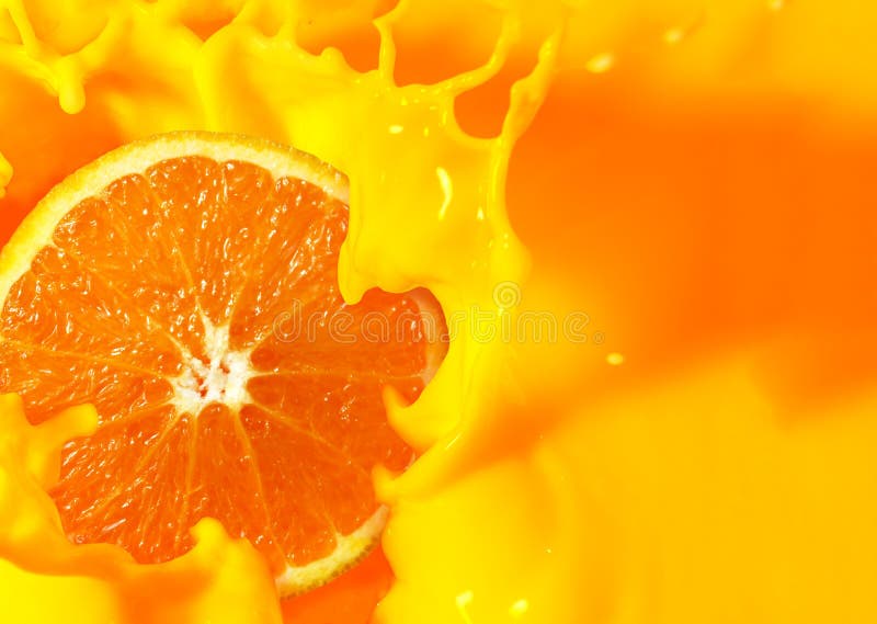 Orange fruit cut in half with orange juice splash royalty free stock photos Orange fruit cut in half with orange juice splash royalty free stock photos