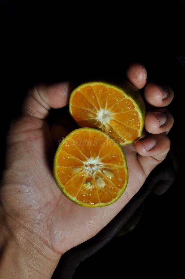 Orange Fruit Isolated on Black Background. Fresh and Healthy Stock