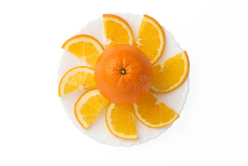 Orange fruit with slices on plate