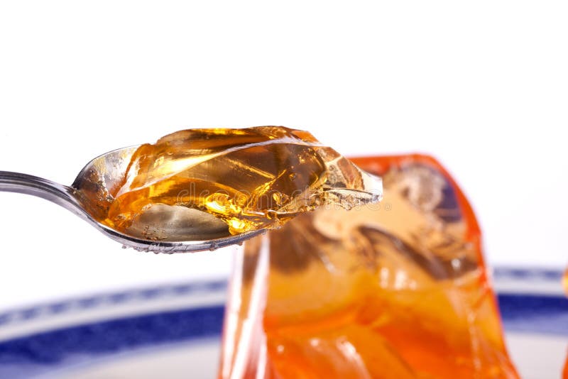 Orange Gelatin Capsules with Powder, Isolated on White Background