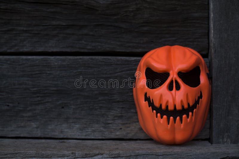 Orange Ghost Mask placed in an old house in the dark royalty free stock photos Orange Ghost Mask placed in an old house in the dark royalty free stock photos