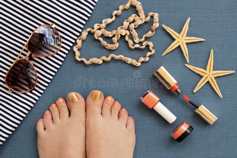 Orange with gold lacquer pedicure