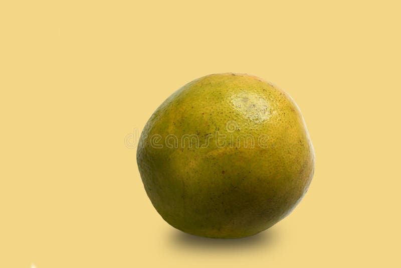 Orange isolated on yellow background stock photos