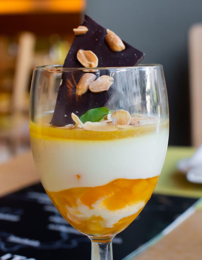 Orange Italian Panna Cotta Served in a Wine Glass, with Dark Chocolate ...