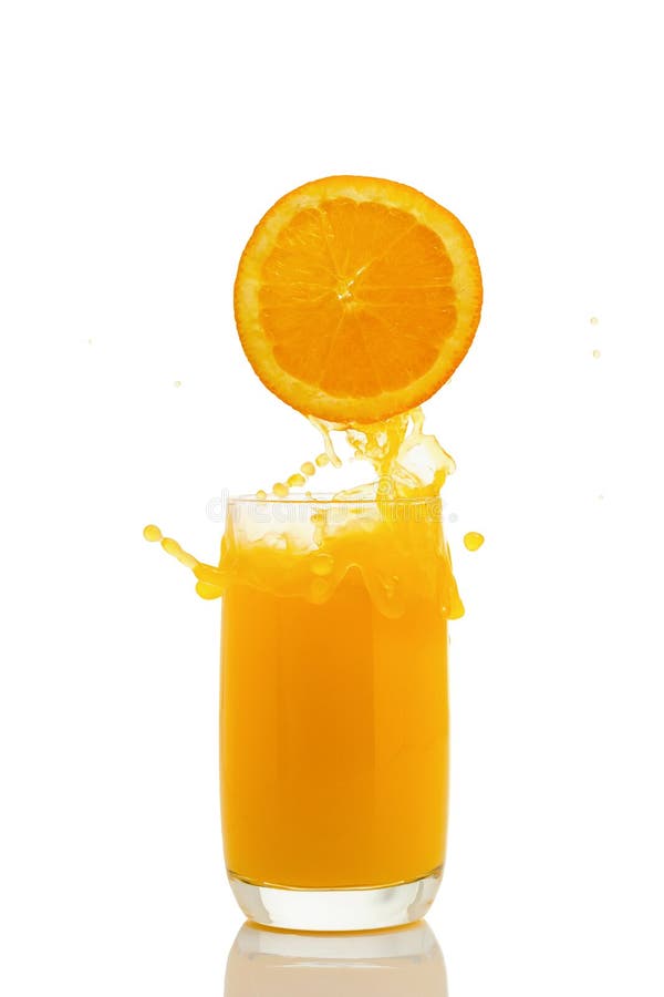 Orange juice splashing out of a glass