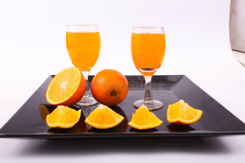 Orange juice in cups stock image. Image of black, delicious - 115515191