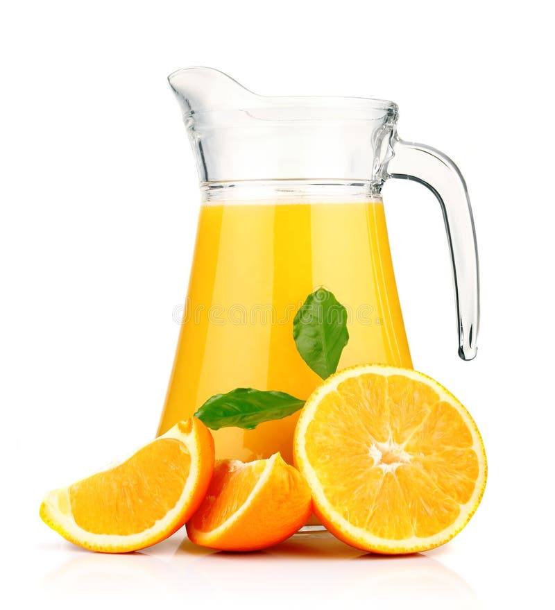 Orange juice in pitcher and oranges. 