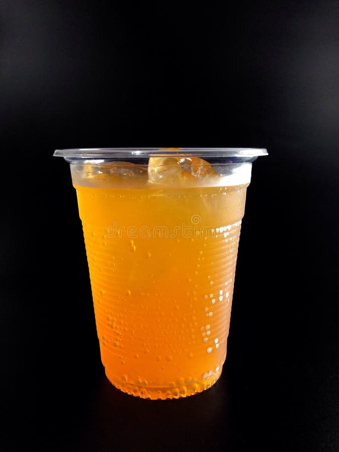 Plastic Glasses With Orange Juice Stock Photo - Image of ...