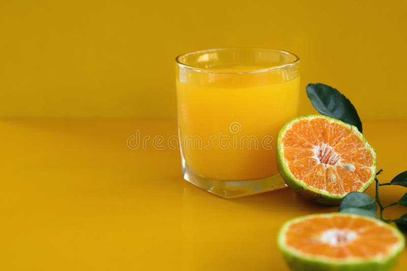 Orange Juice on Yellow Background Stock Photo Image of squeezed