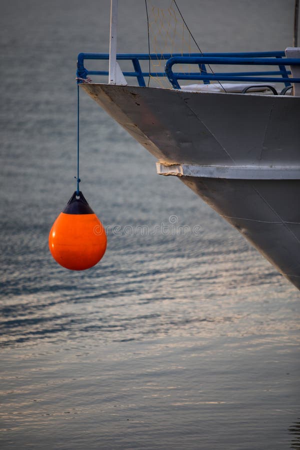 Orange Mooring Buoy and a Ship Stock Photo Image of hull, detail