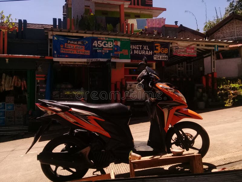 An Orange Motorcycle Parked in Front of the Shop Editorial Stock Image Image of shop, front