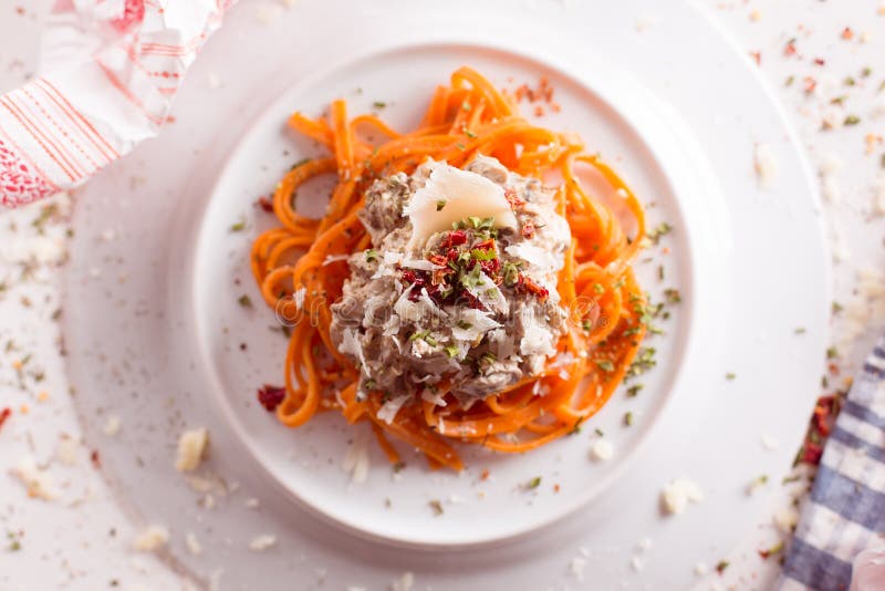 Orange Pasta and White Sauce Served on White Plate Stock Photo Image