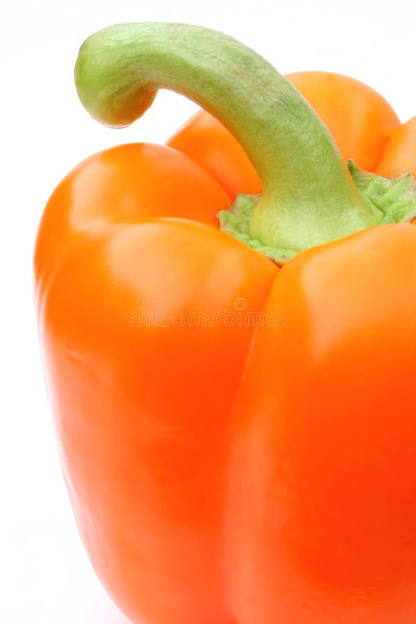 A Partial View of an Orange Pepper is Presented against a White Background.