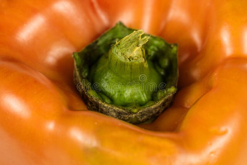 Orange organic pepper vegetable background closeup. Orange organic pepper vegetable background closeup