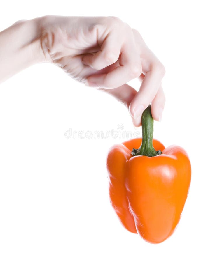 Orange pepper in hand isolated on white