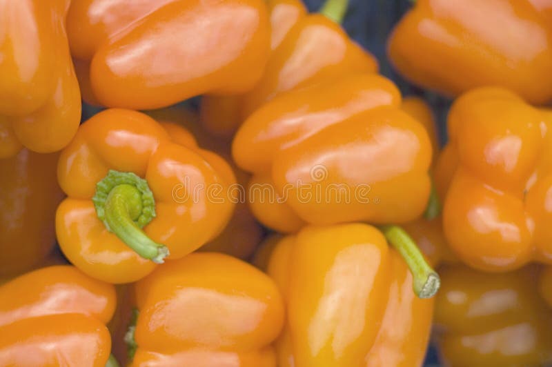 Orange pepper in a supermarket background