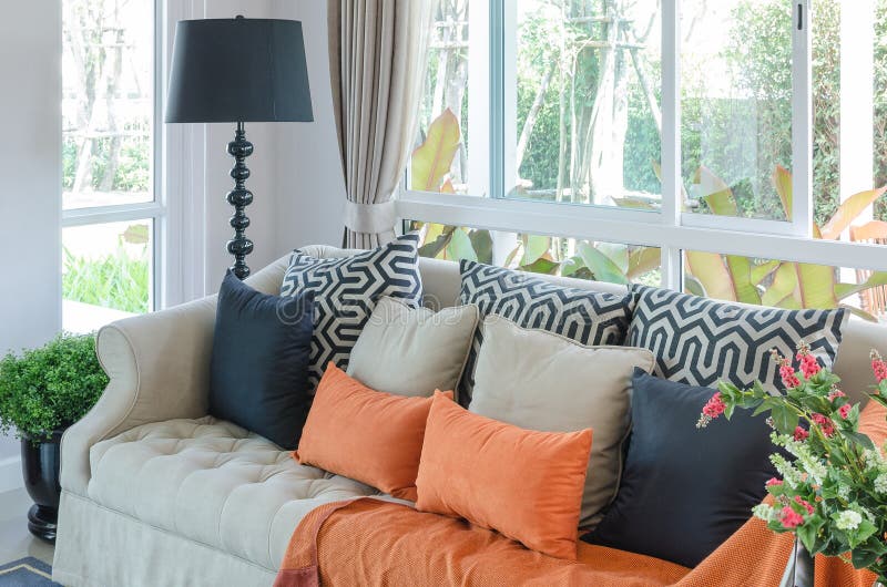 Orange Pillows and Blanket on Classic Sofa in Living Room Stock Image