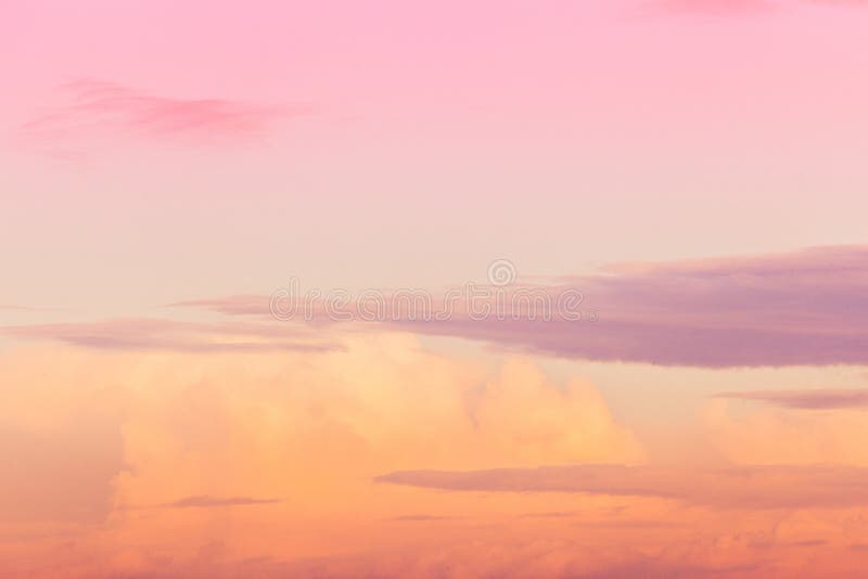 Orange and Pink Sky with Clouds at Sunset Background Stock Image