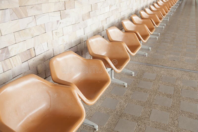 Orange plastic chair stock photo. Image of public, outdoor 46001048