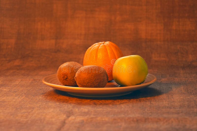 Orange, pomme, kiwi Aliment biologique images stock Orange, pomme, kiwi Aliment biologique images stock