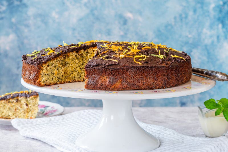 Orange and poppy seed cake stock photo. Image of icing 190989782