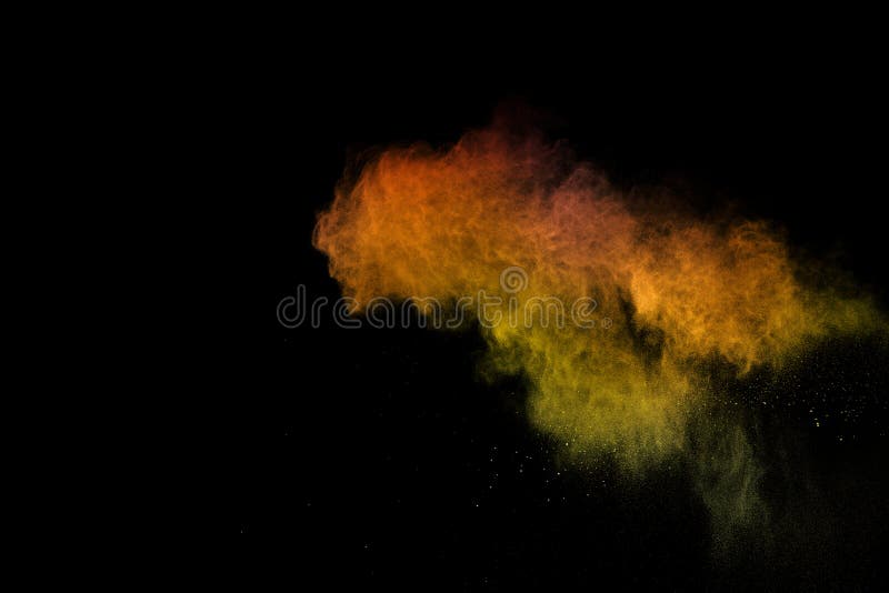 Orange Powder Explosion on Black Background. Colored Cloud. Colorful