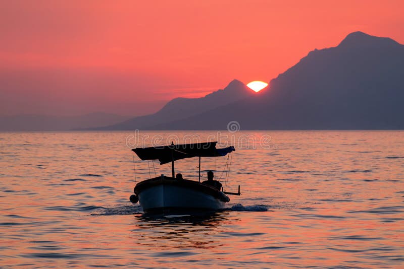 Orange sunset, sea and boat in Croatia royalty free stock photo Orange sunset, sea and boat in Croatia royalty free stock photo