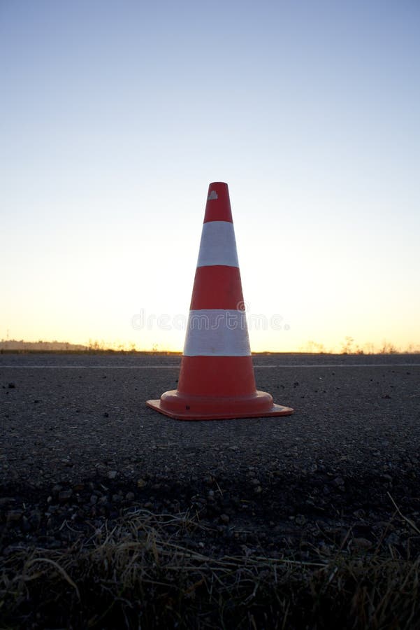 Orange road cone stock image. Image of asphalt, glow 34230207