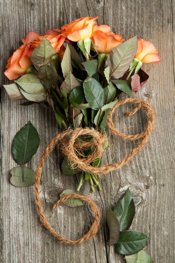 Orange roses with cord