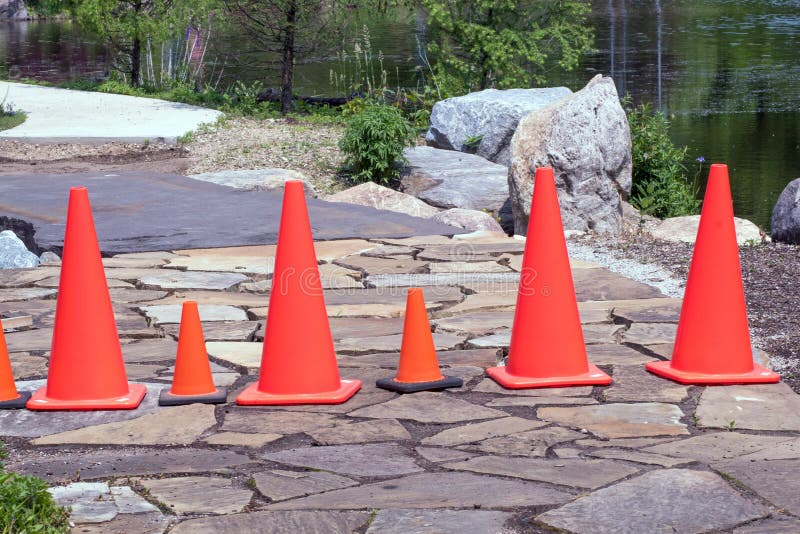 Orange safety cones block a road