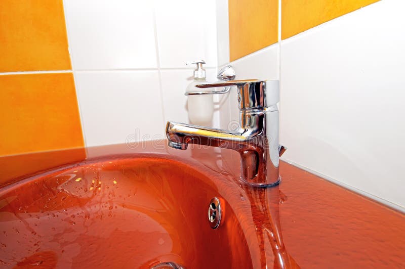 Modern orange sink stock photo. Image of drop, apartment 8088080