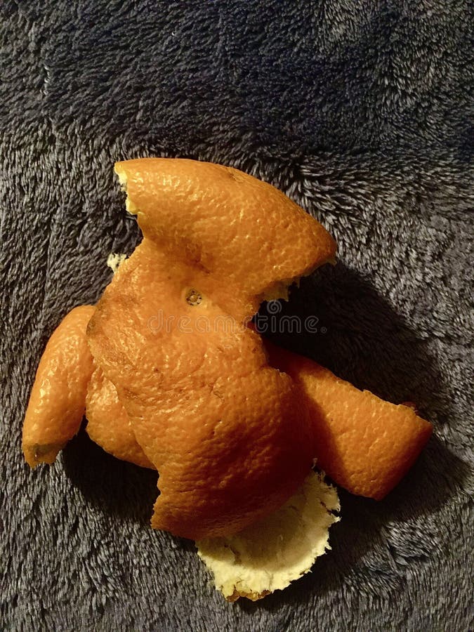 Orange Skins on a Blue Bedspread. Light and Shadow Stock Image Image
