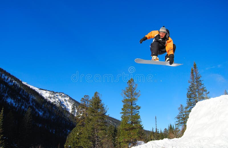 Orange snowboarder jumping img