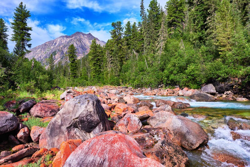 Orange stones in line with the mountain river