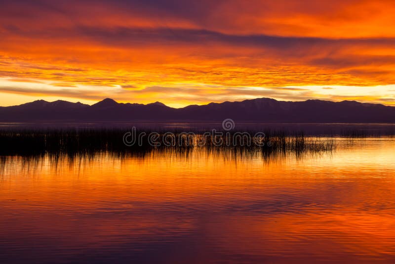 Orange Sunset with Mountains Stock Photo - Image of calm, reeds: 28003616