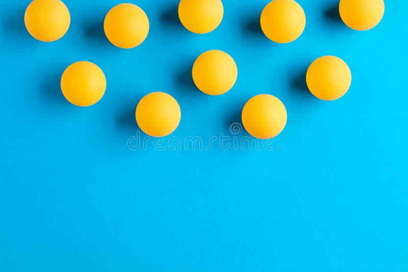 Orange Table Tennis or Ping Pong Balls on Blue Background Stock Image