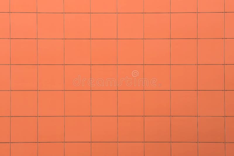 Orange tile wall, building`s facade, background and texture.