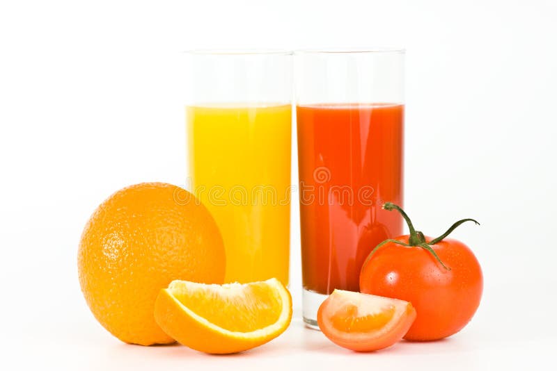 Orange and tomato fruits with juice in the glass