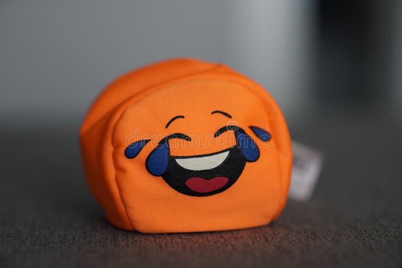 Orange Toy with a Laughing Emoji Face Stock Image Image of orange
