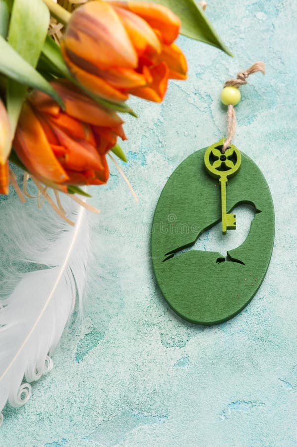 Orange tulips with wooden key bird stock photography Orange tulips with wooden key bird stock photography