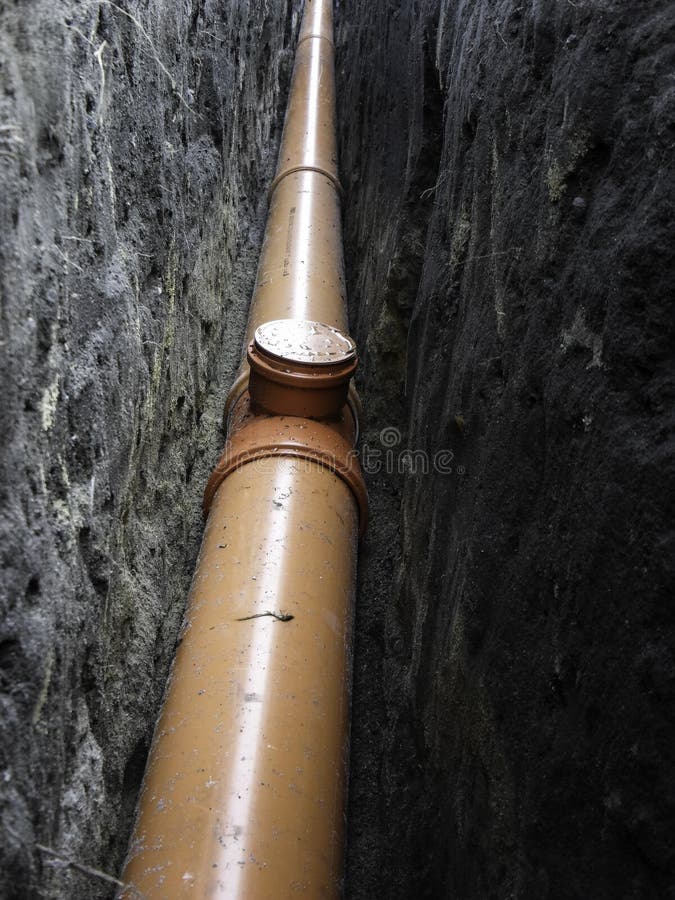 Orange Water Pipes Laid Under the Ground Water Support Stock Image