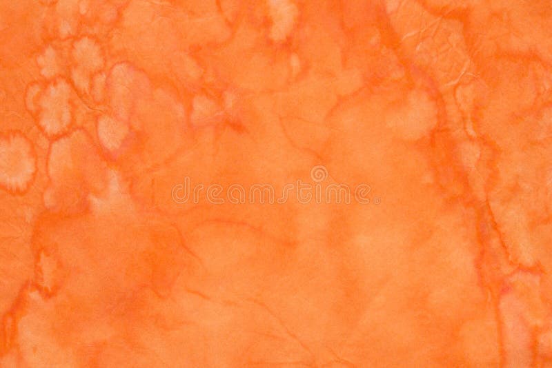 Orange watercolor painted background texture on creased paper