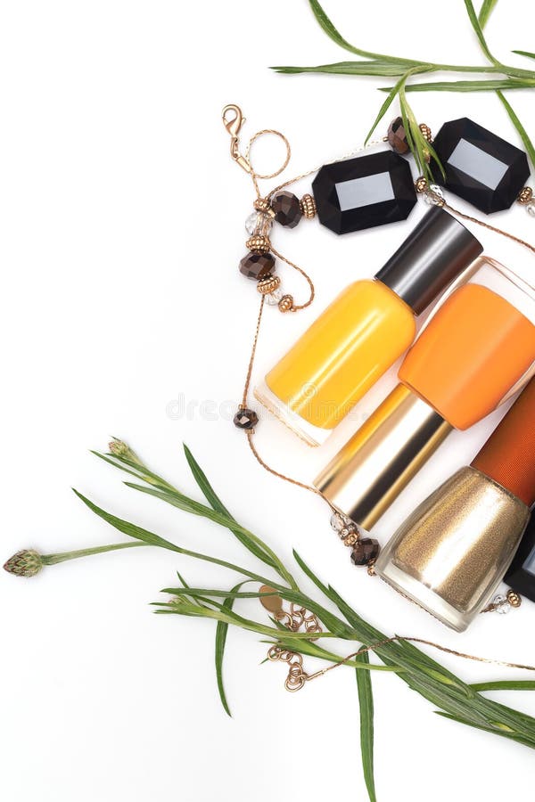 Orange and Yellow Nail Polish Bottles on White Background Stock Image