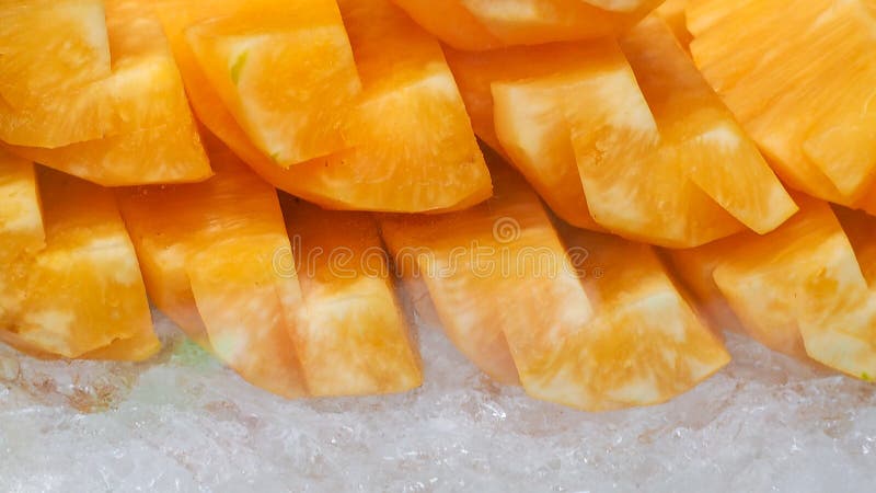 Orange or yellow pineapple sliced on crushed ice. Tropical fruit. Healthy snack. Bromelain enzyme extracted from pineapple. Source stock images