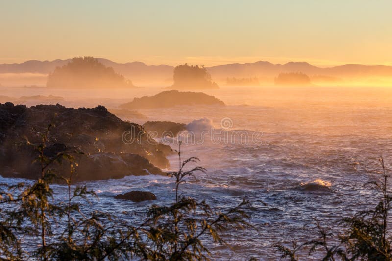 Orange, yellow and pink mist over Pacific Ocean, Ucluelet, BC