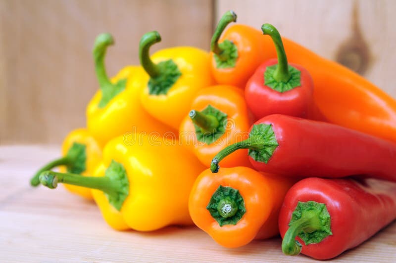 Three Bell Peppers In Yellow, Orange, And Red Stock Photo Image of