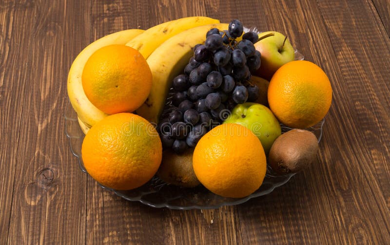 Oranges Apples Bananas And Grapes Are In Dish Stock Photo Image Of