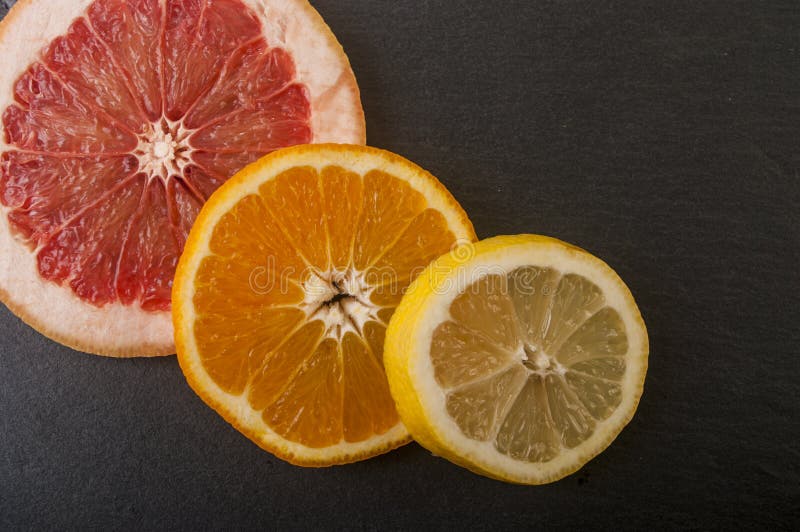 Oranges, Grapefruit ,lemon on a Black Background Stock Photo Image of