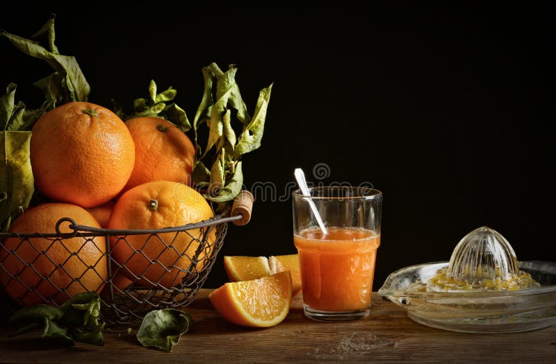 Oranges juice on wooden table with black background royalty free stock photo Oranges juice on wooden table with black background royalty free stock photo