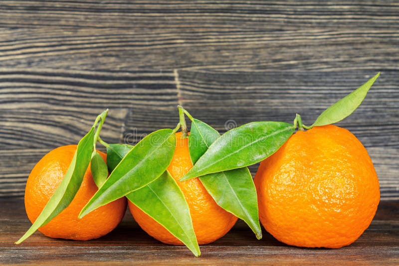 Oranges with Leaves on Wood Stock Photo Image of yellow, mandarin